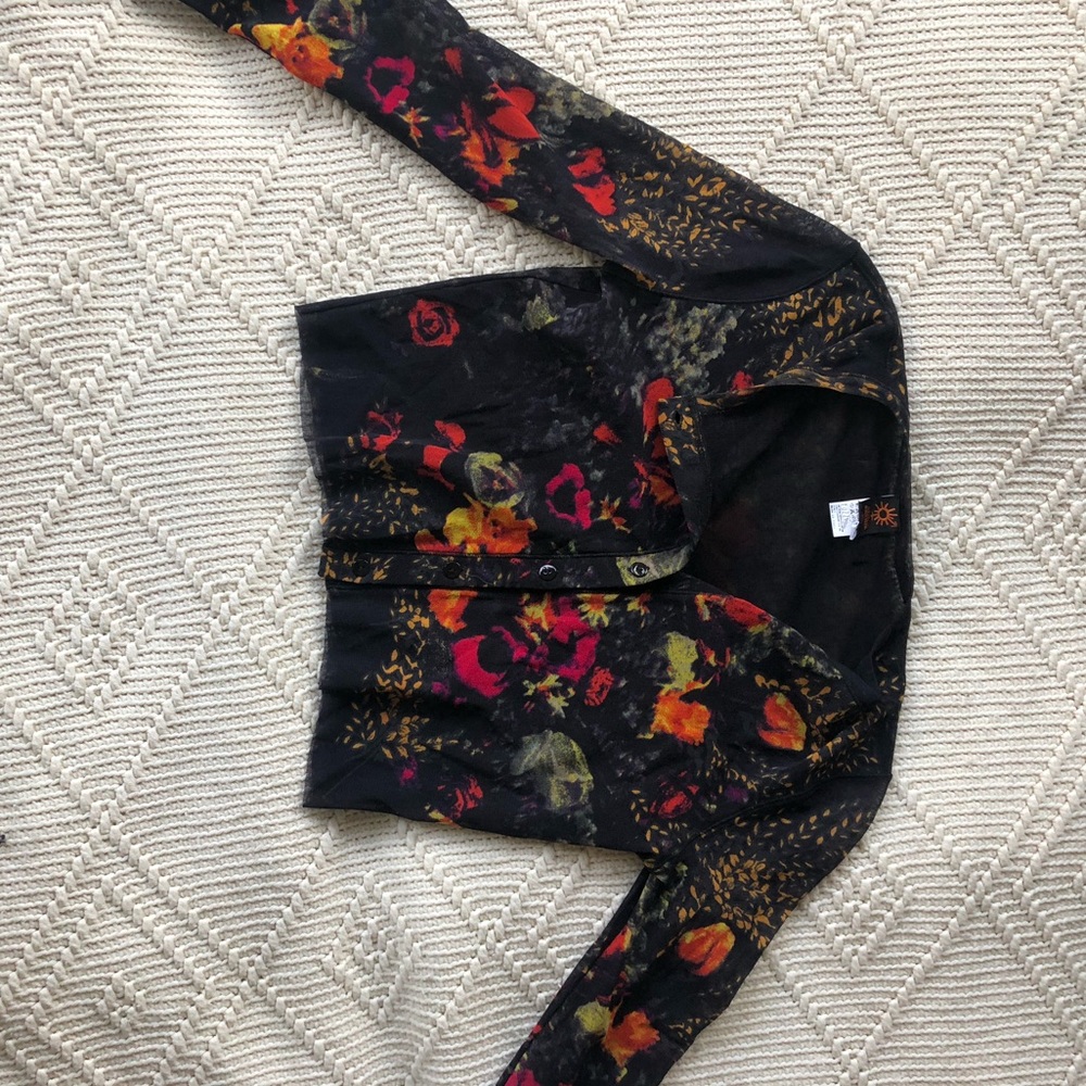 A cropped mesh Jean Paul Gaultier blouse